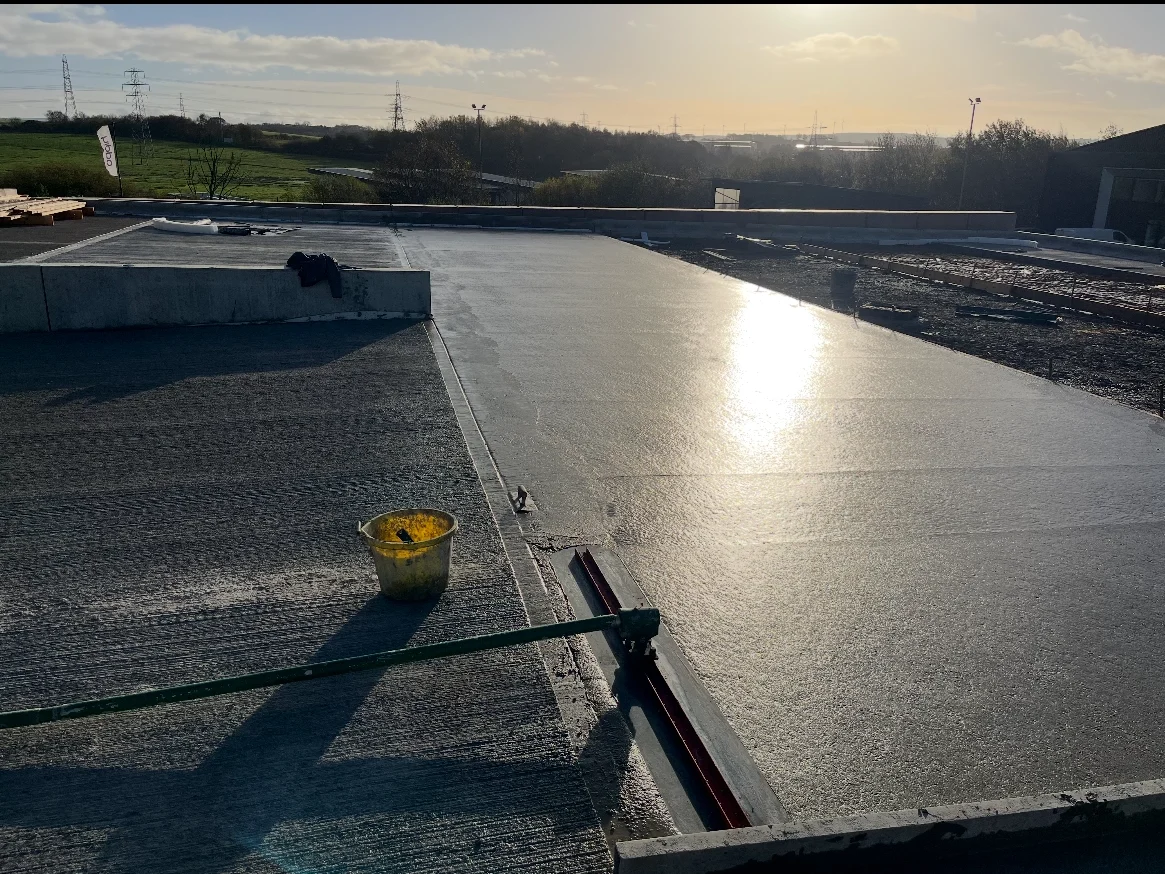 Large industrial concrete flooring project in Wrexham Industrial Estate with shiny finish